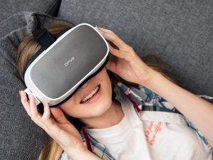 DPVR-P1-Virtual-Reality-Headset-Being-Used-by-woman-on-sofa